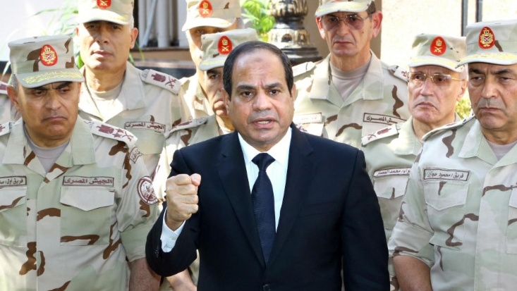 Egyptian President Abdel Fattah al-Sisi, surrounded by top generals, is pictured in Cairo in October 2014 (Egyptian Presidency/AFP)