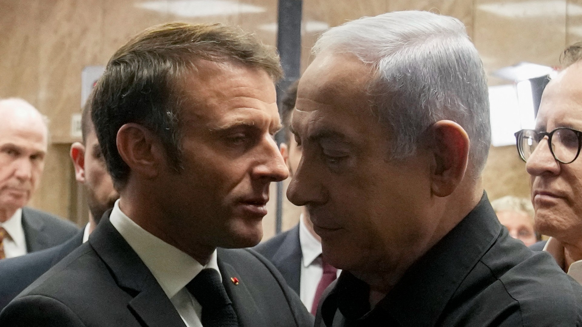 Israeli Prime Minister Benjamin Netanyahu (R) shakes hands with French President Emmanuel Macron (L) after their joint press conference in Jerusalem on October 24, 2023.