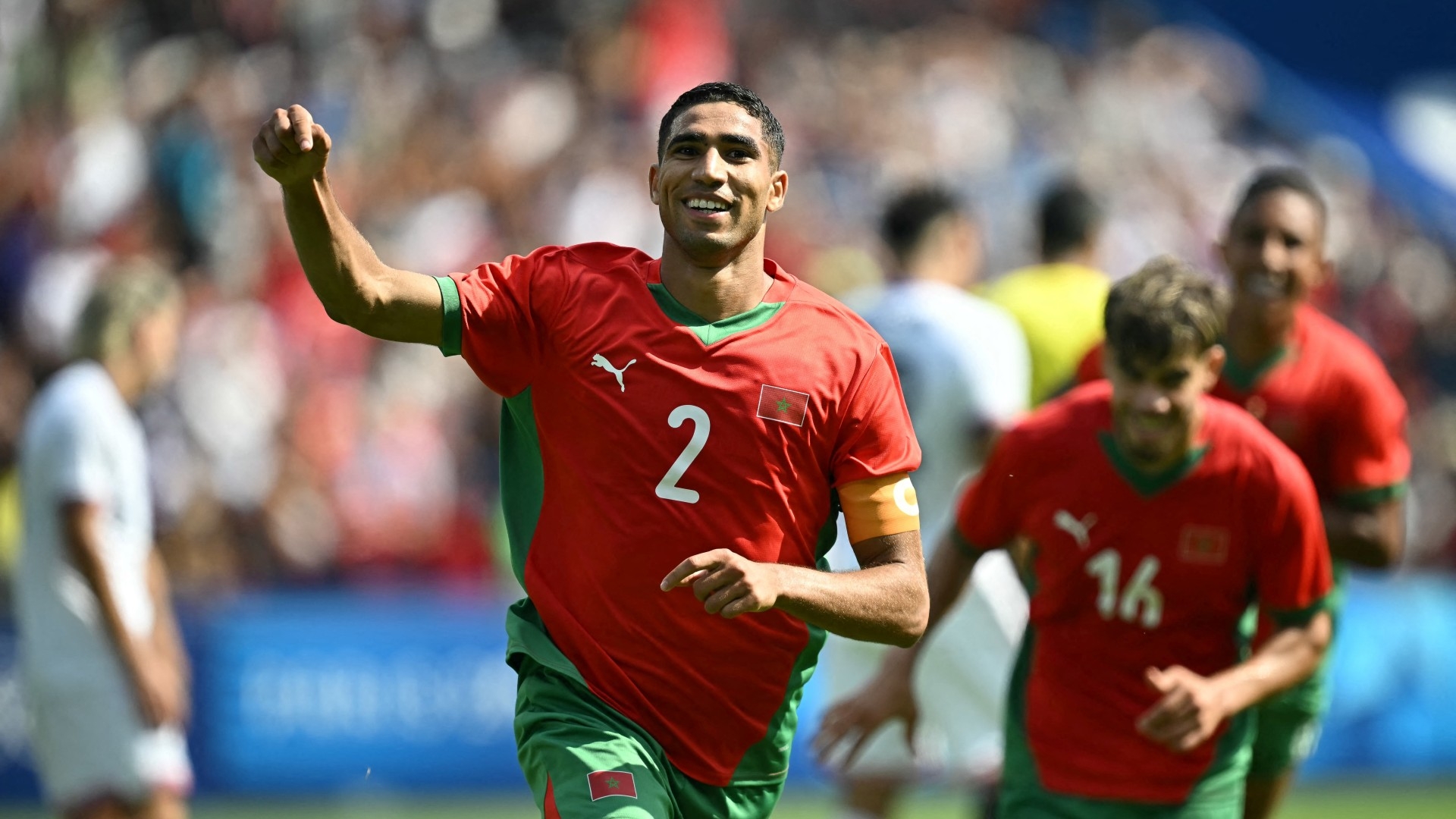 Morocco's captain Achraf Hakimi celebrates after scoring a goal against the US in the Paris Olympics football semifinals on 2 August. AFP/Paul Ellis.