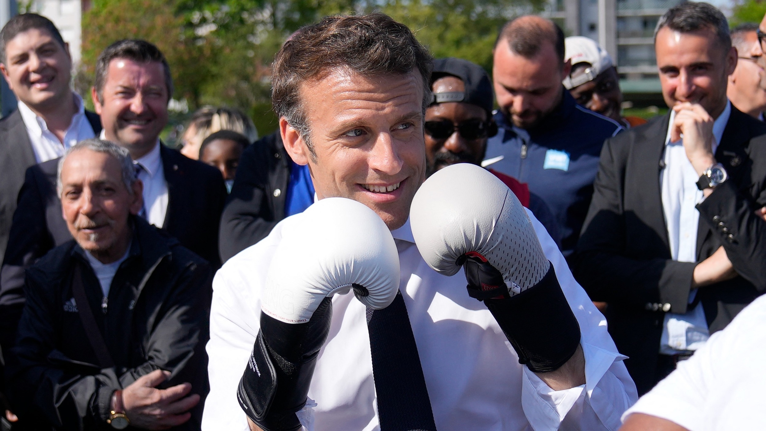 French President and presidential candidate Emmanuel Macron poses on 21 April, 2022 during a campaign visit outside Paris (AFP)