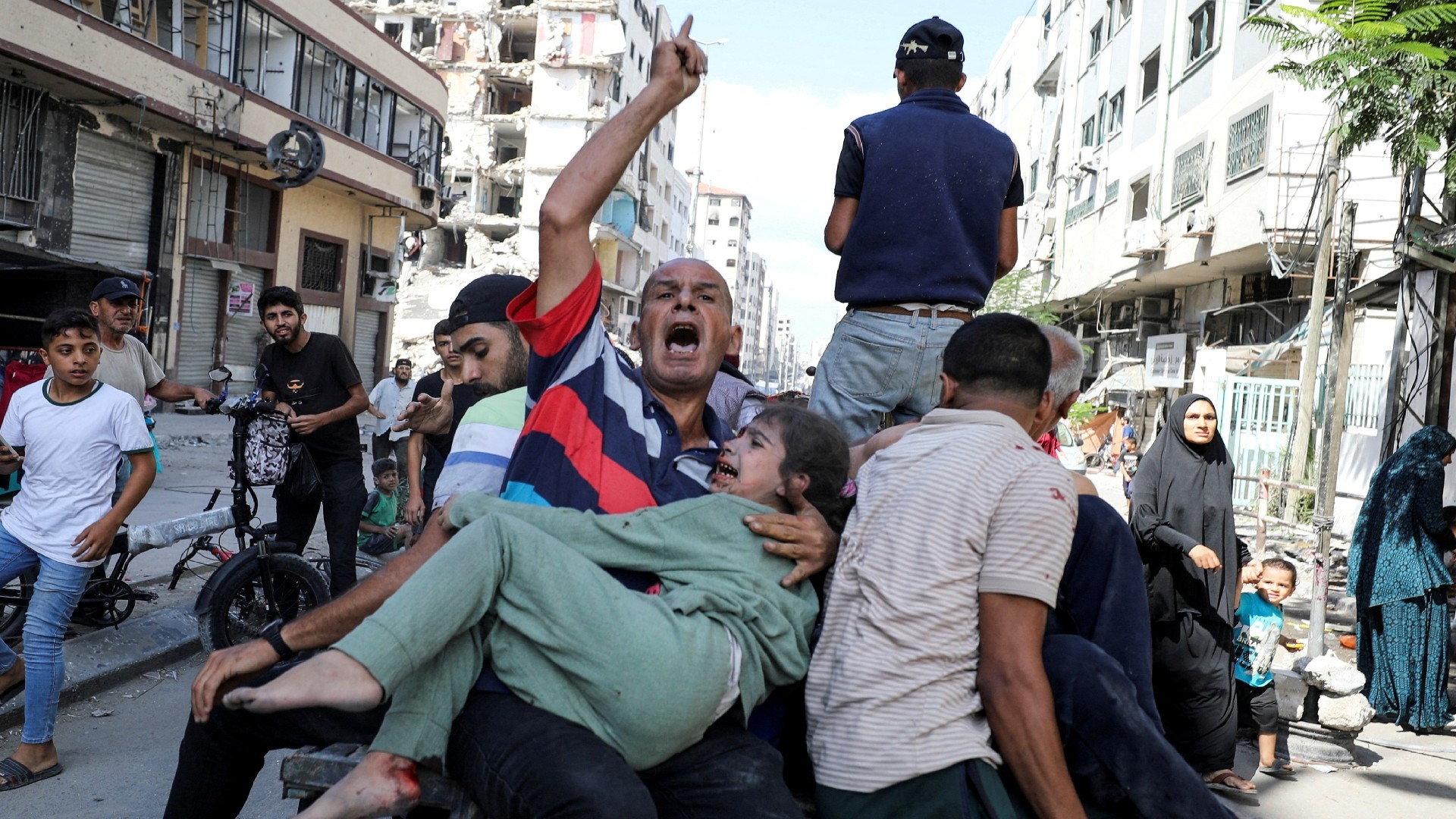 Palestinians react in the aftermath of an Israeli strike at al-Remal clinic, which had been sheltering displaced people, on October 10 2024 (REUTERS/Dawoud Abu Alkas)