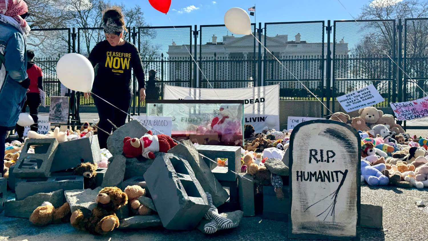 Plush toys for young Palestinian victims in the war on Gaza are placed in front of the White House in Washington on 13 January 2024.