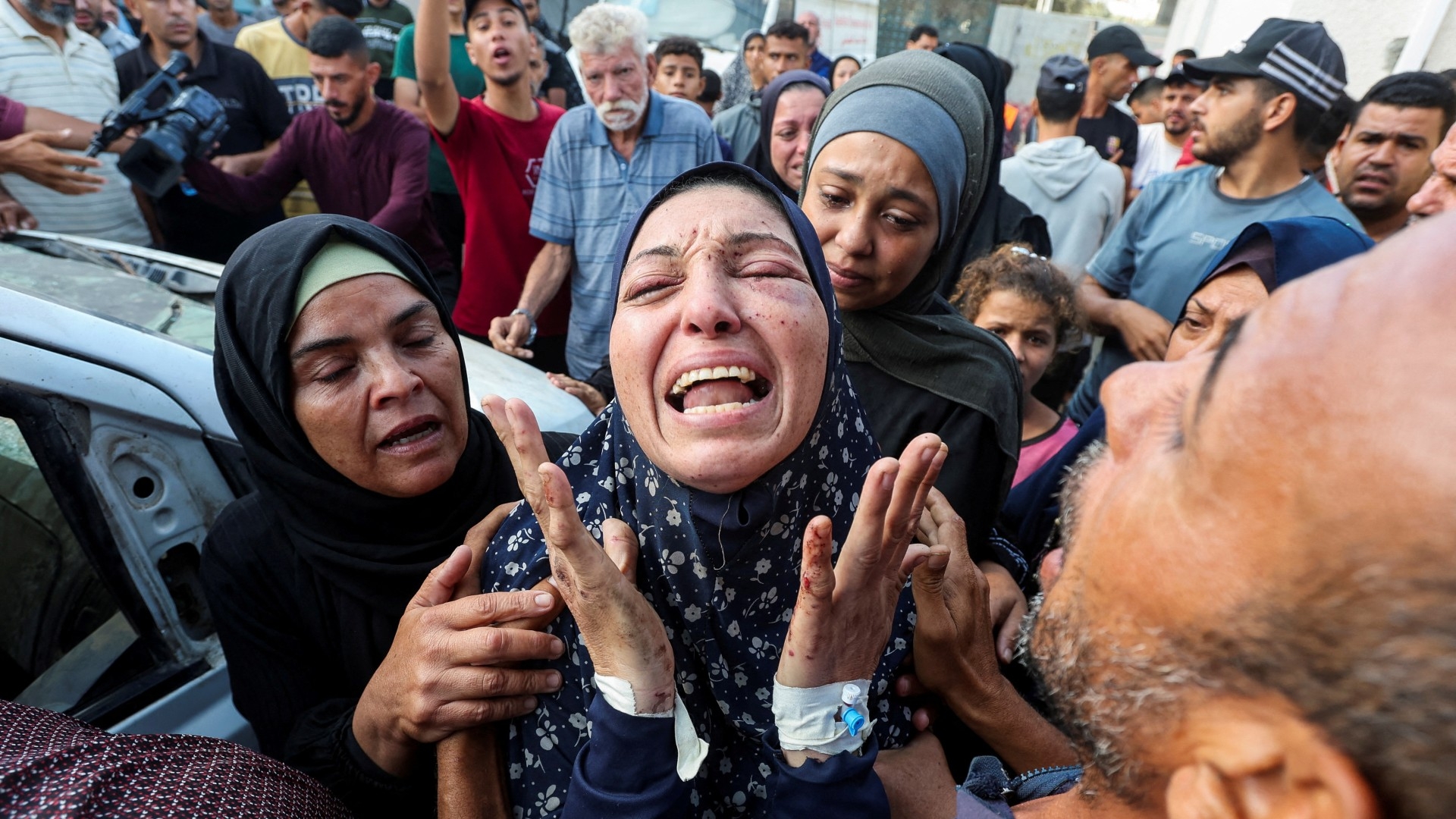 The grandmother of Palestinian boy Yaman Al-Zaanin, who was born and killed amid the ongoing Israel-Hamas conflict and lost his life in an Israeli strike on a school-turned shelter, according to medics, reacts at Al-Aqsa Martyrs Hospital in Deir Al-Balah in the central Gaza Strip, October 14, 2024. REUTERS/Ramadan Abed TPX IMAGES OF THE DAY