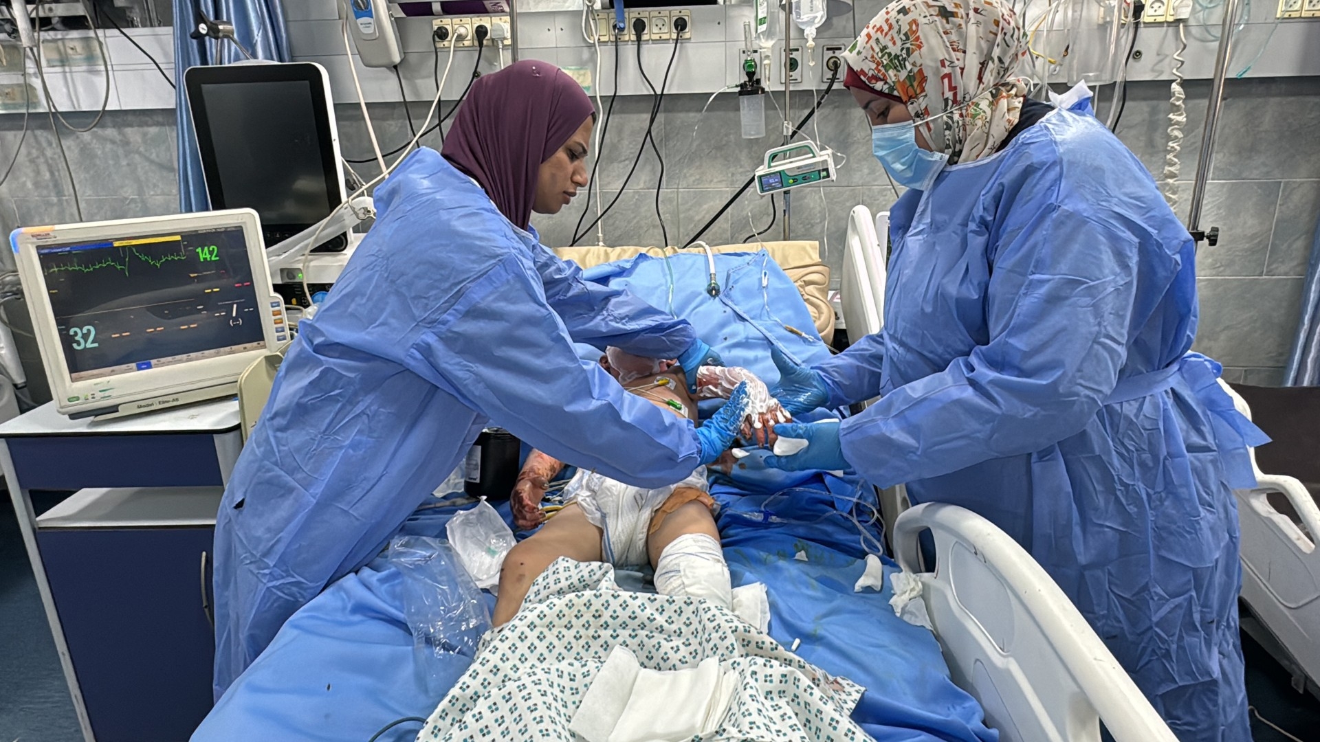 A wounded infant receives medical care at northern Gaza's Kamal Adwan Hospital on 24 October 2024, a day before an Israeli attack forced the hospital to cease operations (AFP)