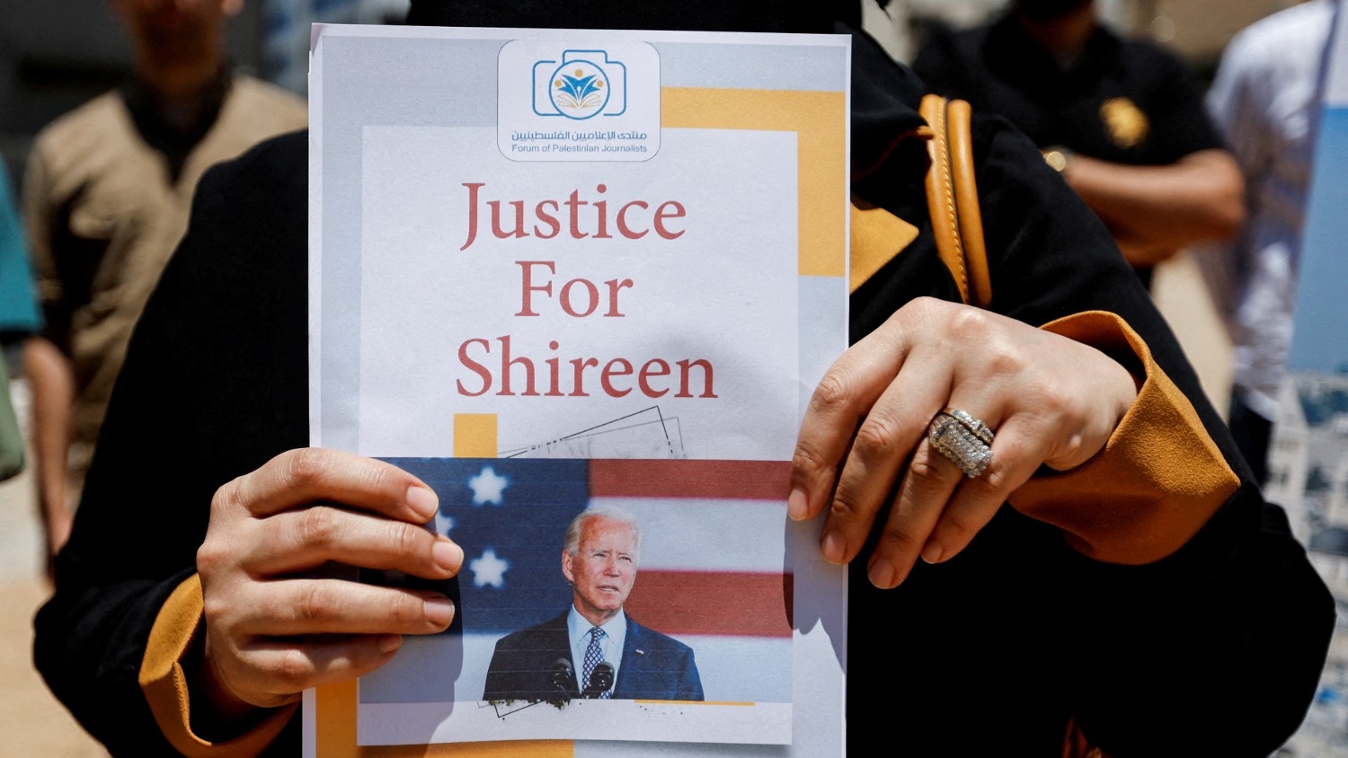 Palestinians attend a protest demanding US President Joe Biden to achieve justice for Al Jazeera journalist Shireen Abu Akleh in Gaza City on 13 July 2022.