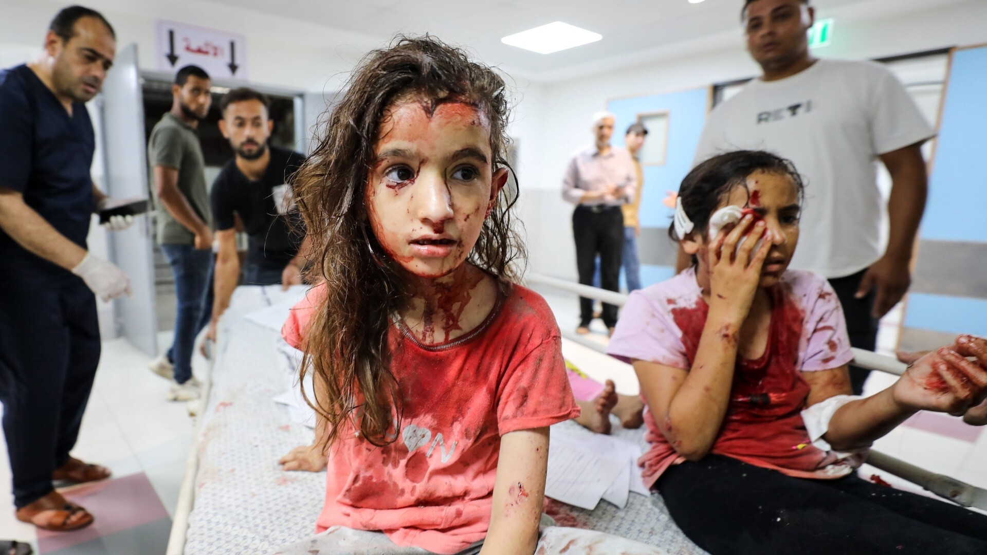 Palestinian medics treat wounded children at al-Shifa hospital in Gaza in October 2023 (Reuters/IMAGO/Atia Darwish)