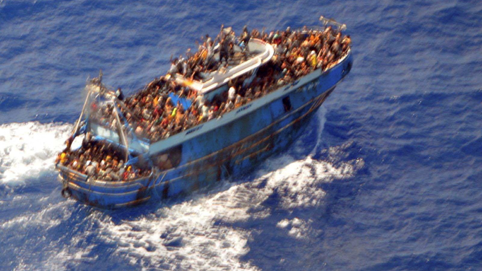 An undated photo shows people onboard a boat during a rescue operation, before their boat capsized on the open sea, off Greece on 14 June 2023 (Reuters)