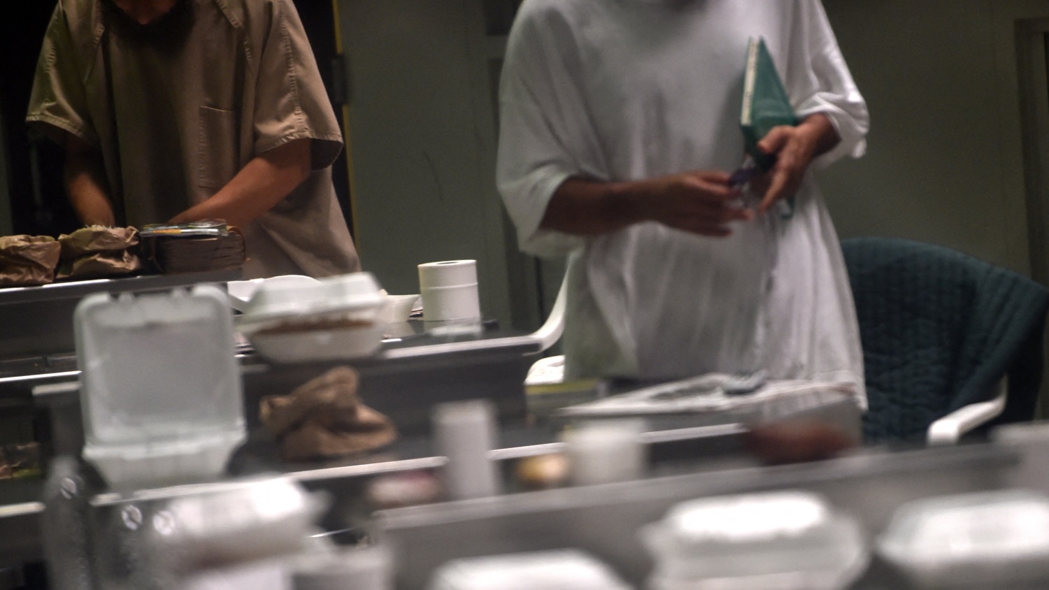 This photo made during an escorted visit and reviewed by the US military shows unidentified detainees at "Camp 6" detention facility at the US Naval Station in Guantanamo Bay, Cuba on 8 April 2014.