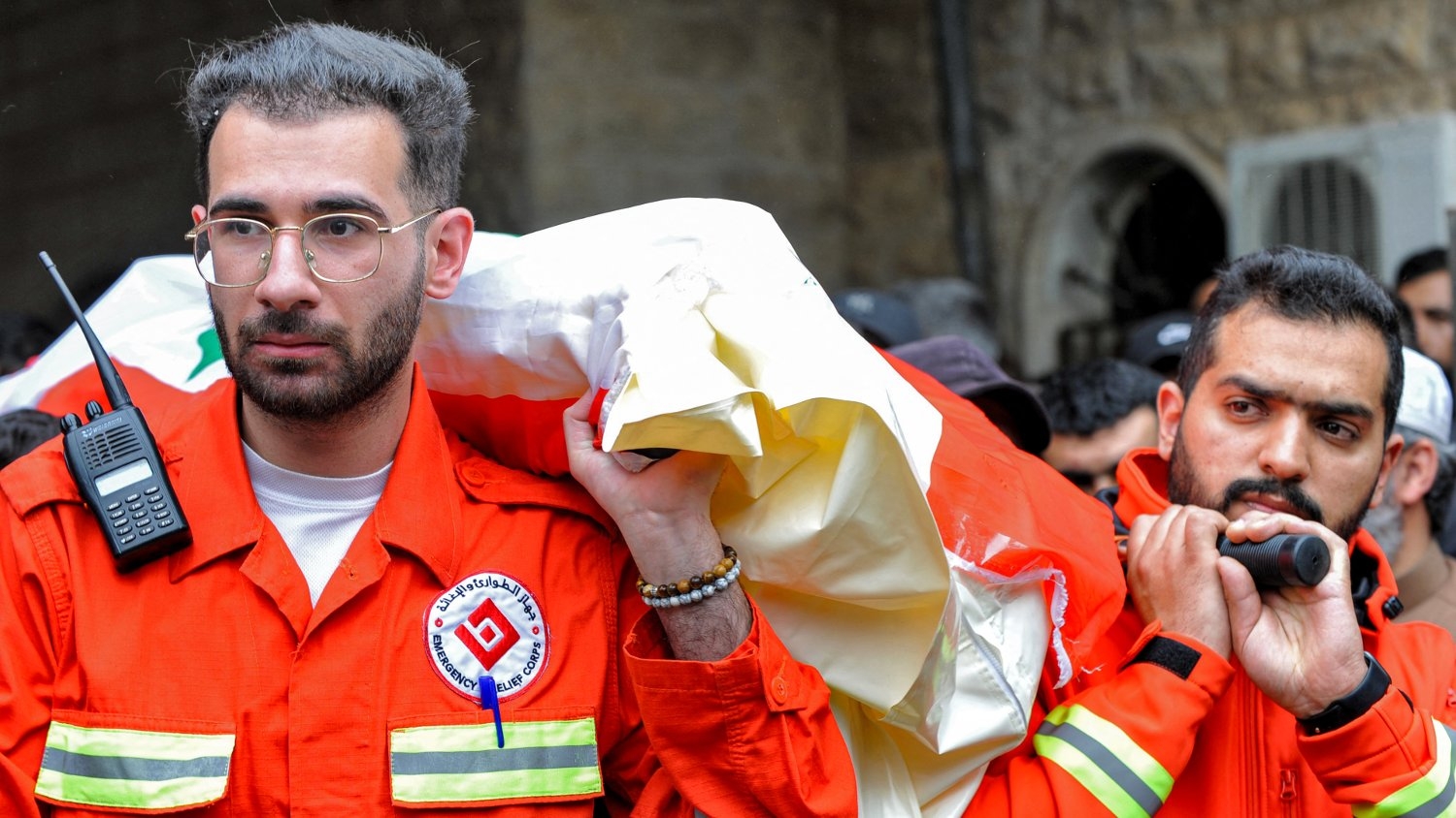 Members of the Lebanese NGO Emergency and Relief Corps carry the body of one of the victims killed in overnight Israeli bombardment on 27 March 2024.