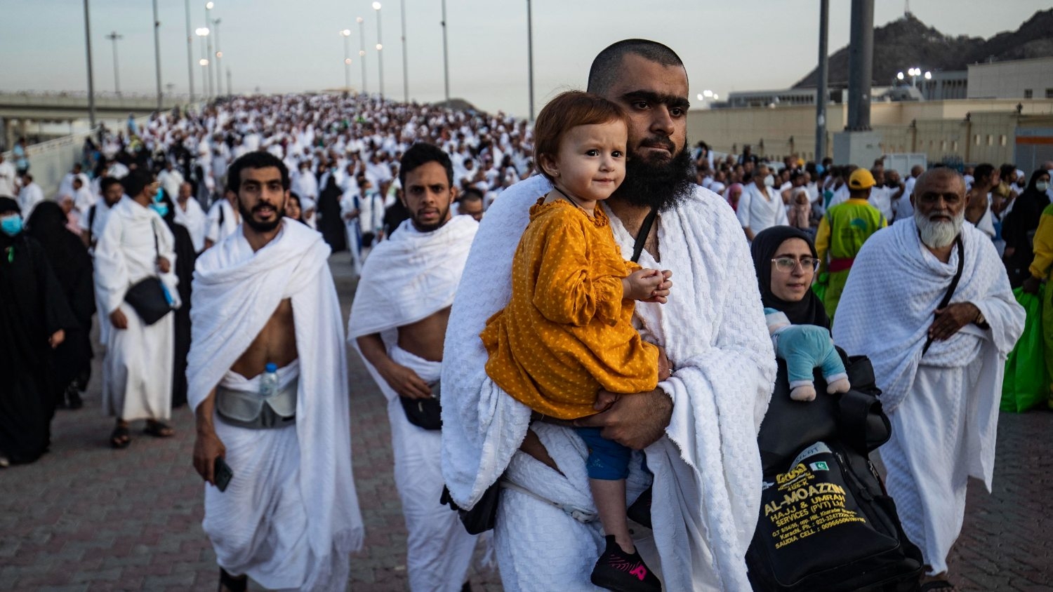 Thousands of Muslim pilgrims make their way across the valley of Mina, near Mecca in western Saudi Arabia 9 July 2022.