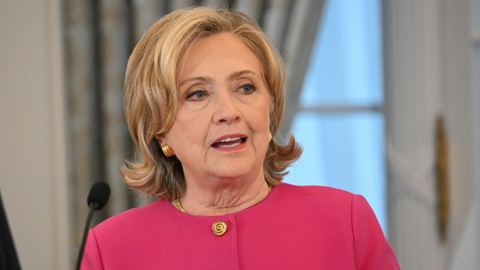 Former secretary of state Hillary Clinton speaking at the unveiling of her portrait, in the Benjamin Franklin Room of the US Department of State in Washington, DC, on 26 September 2023 (AFP/Mandel Ngan)