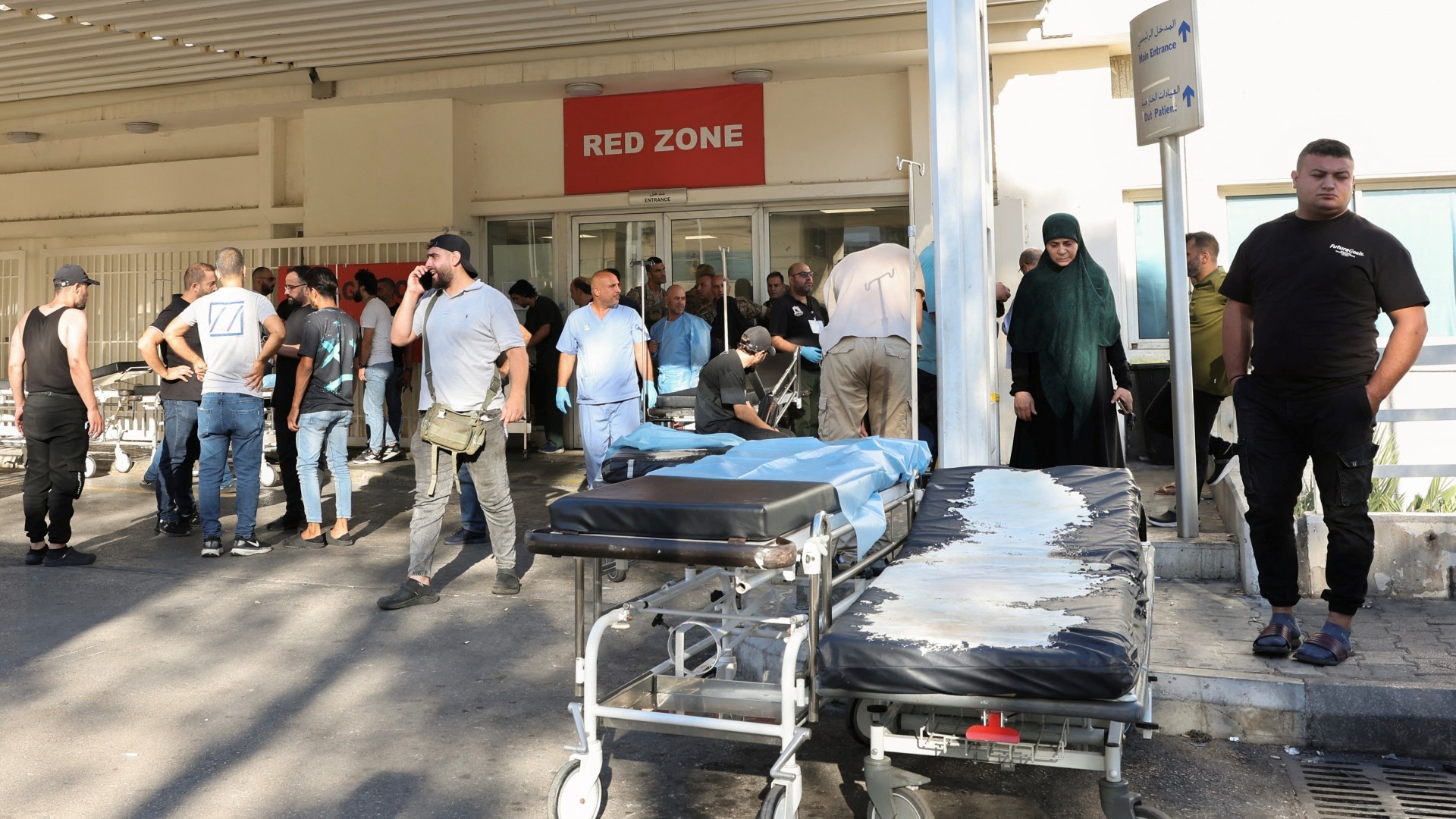 People gather outside a hospital, after hundreds were seriously wounded by exploding communications devices, in Beirut, Lebanon on 17 September 2024 (Reuters/Mohamed Azakir)