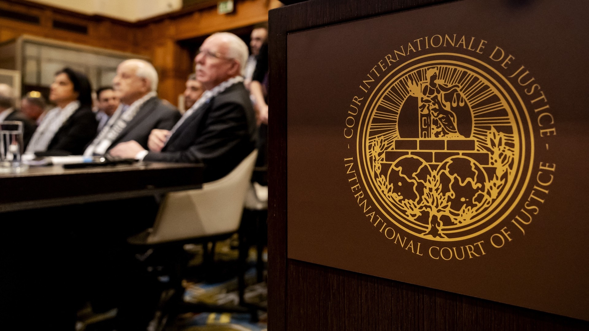 A Palestinian delegation listens at the start of a hearing at the ICJ in the Hague on 19 April (AFP/Robin van Lonkhuijsen/ANP)