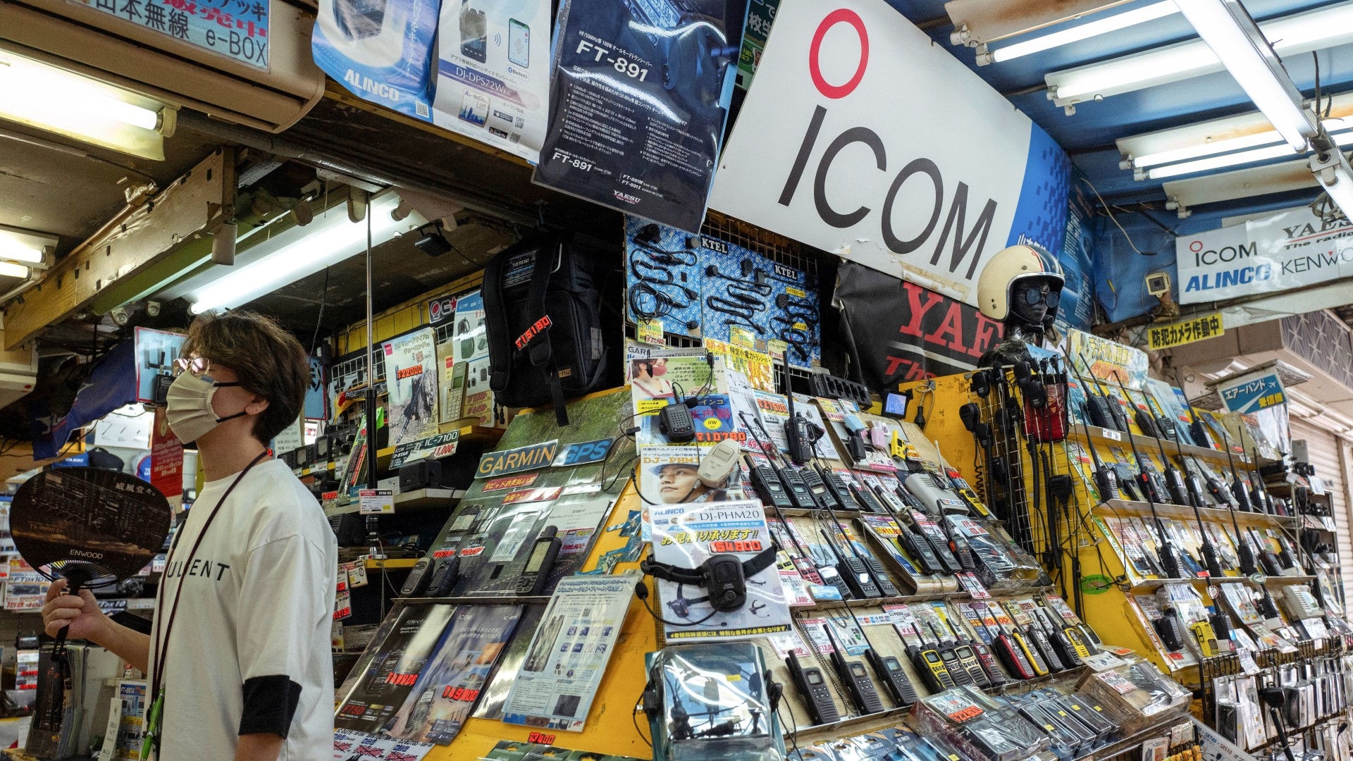 A sign with the logo of Japanese walkie-talkie maker Icom is displayed at a shop in Tokyo's Akihabara electric district on 19 September 2024 (AFP/Kazuhiro Nogi)