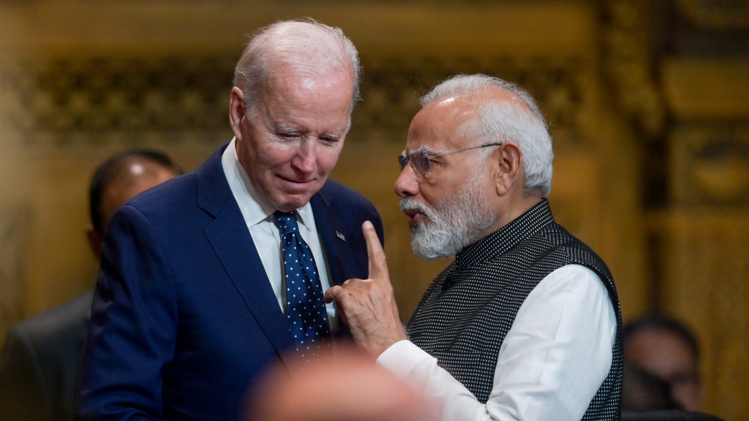 US President Joe Biden talks with India's Prime Minister Narendra Modi at the opening of the G20 Summit in Nusa Dua on the Indonesian resort island of Bali on 15 November 2022.