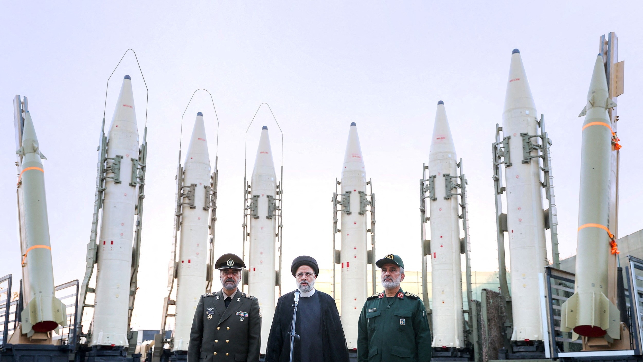 Former Iranian President Ebrahim Raisi speaks in front of ballistic missiles during a ceremony in Tehran, 22 August, 2023 (Iran's Presidency/WANA/Reuters)