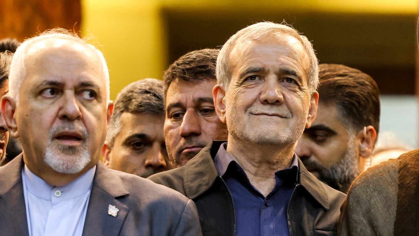 Masoud Pezeshkian, right, and Mohammad Javad Zarif visit Ayatollah Ruhollah Khomeini's shrine in the south of Tehran on 6 July (AFP/Atta Kenare)