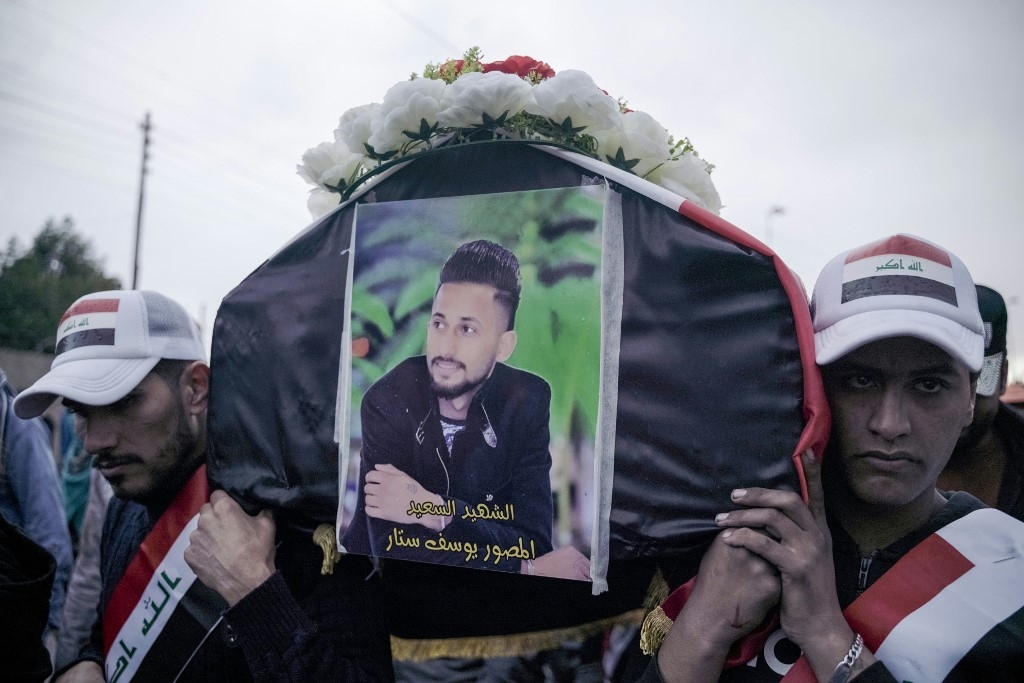 Mourners carry the coffin of Yussef Sattar, a journalist reportedly killed while covering anti-government protests in Iraq in January 2020.
