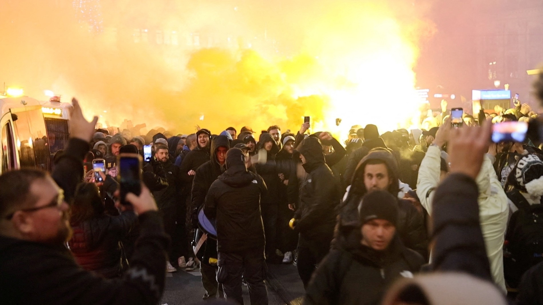 Israeli Maccabi Tel Aviv supporters light flares in Amsterdam, Netherlands, 7 November (Reuters)