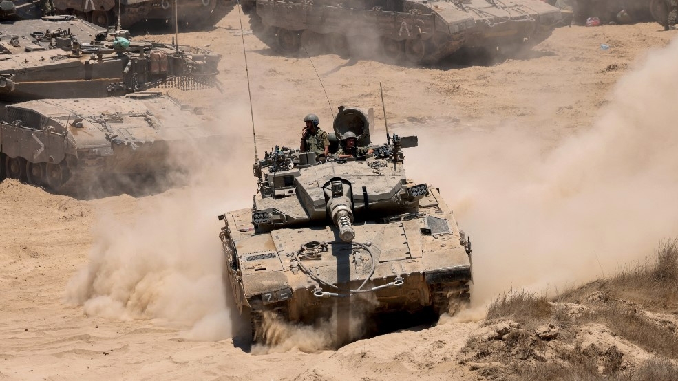 Israeli army tanks are deployed near the Gaza Strip on 5 June 2024 (Jack Guez/AFP)
