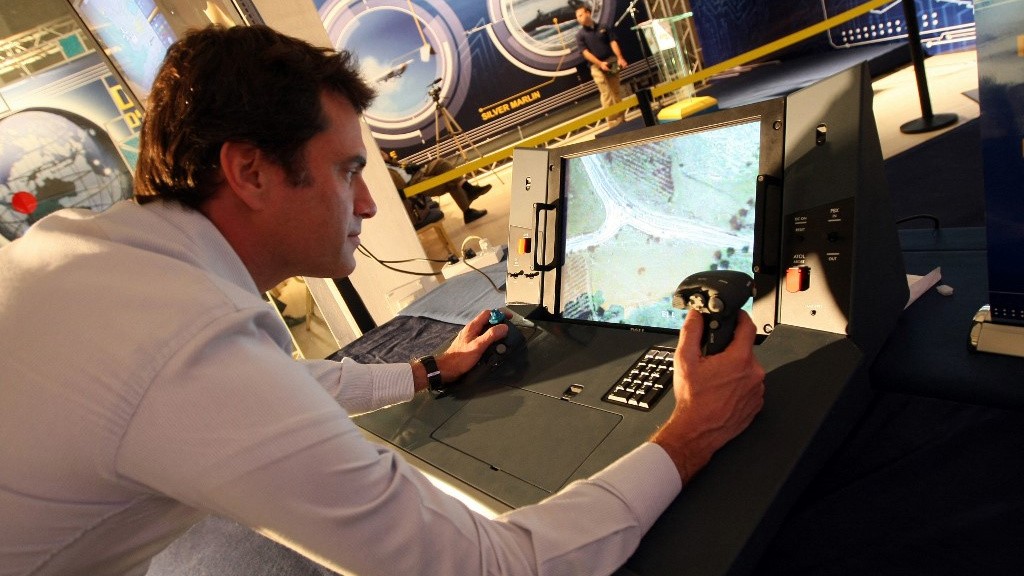 An Elbit Systems technician pilots a remote drone during a presentation of products manufactured by the firm, in Haifa in February 2010 (Jack Guez/AFP)