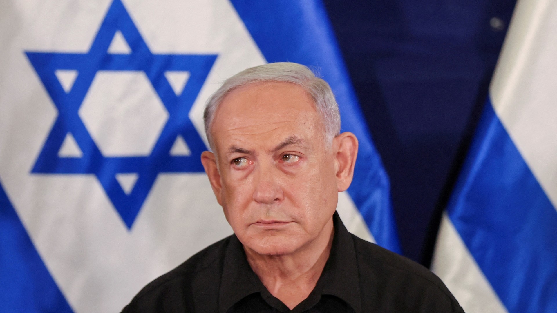 Israeli prime minister Benjamin Netanyahu during a press conference with defense minister Yoav Gallant and Cabinet minister Benny Gantz in the Kirya military base in Tel Aviv, Israel, 28 October 2023 (Reuters)