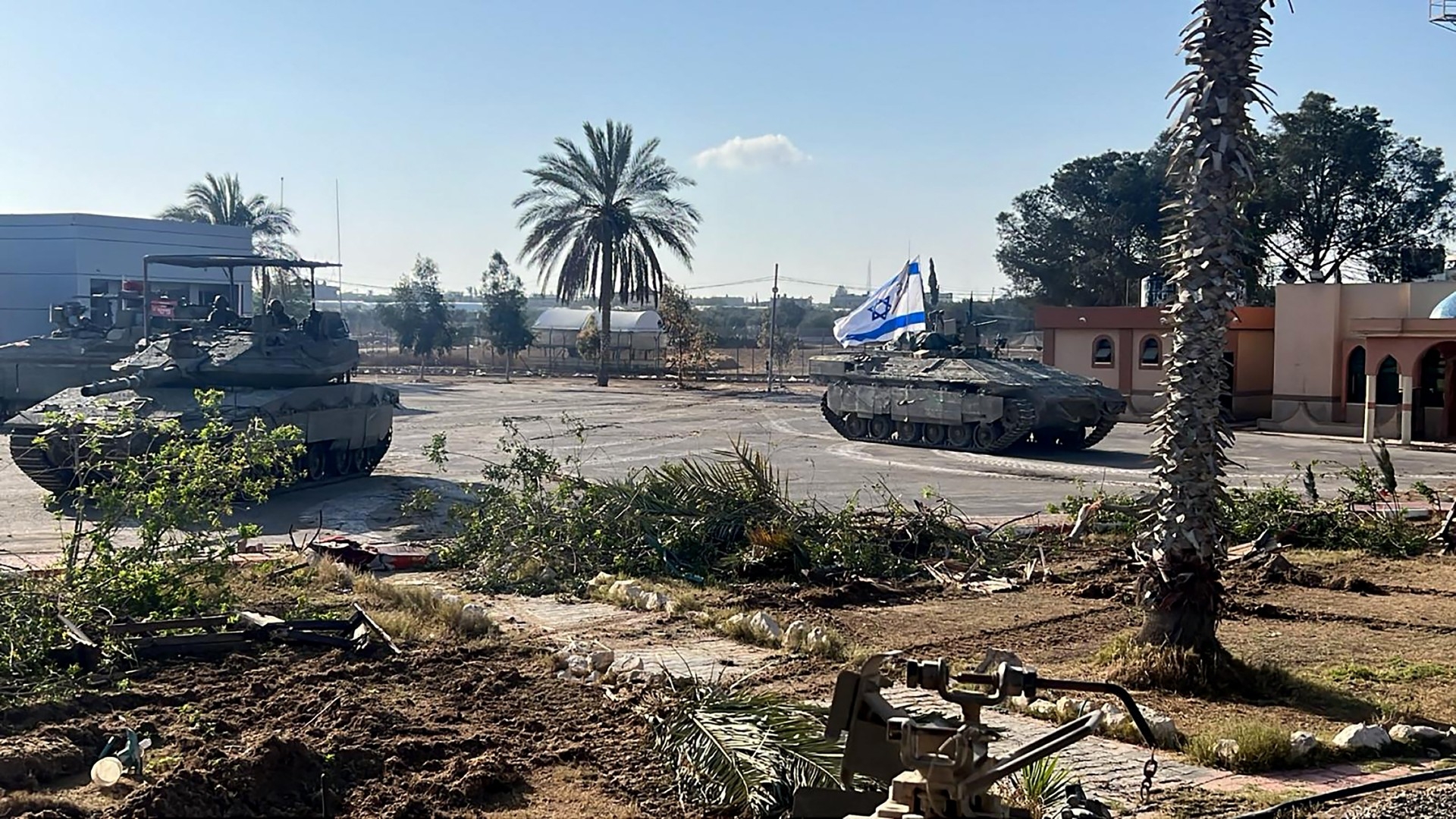 Israel's 401st Brigade's tanks entering the Palestinian side of the Rafah border crossing between Gaza and Egypt in the southern Gaza Strip on 7 May 2024 (AFP/Israeli army handout)