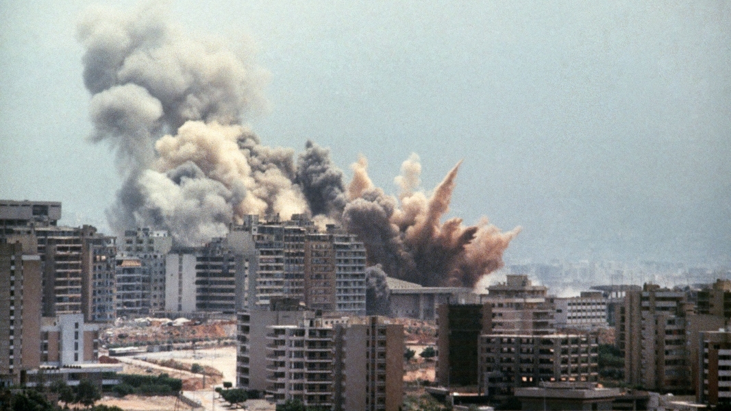 Smoke rises after Israeli shelling in Beirut during its invasion in 1982 (AFP)