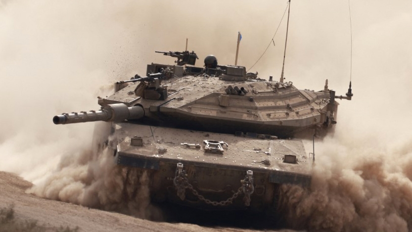 An Israeli tank is seen near the Gaza Strip on 6 October 2024 (Menahem Kahana/AFP)