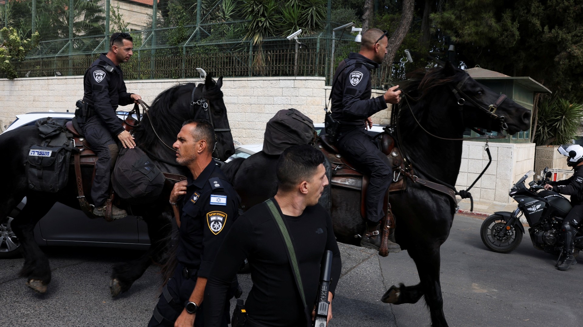Israeli mounted police officers work on the scene following an incident in Jerusalem, 30 October 2023 (Reuters)