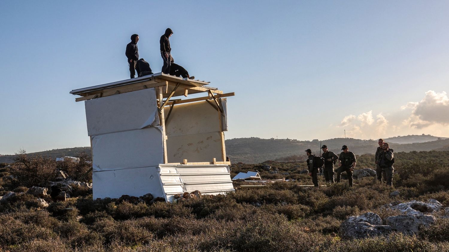 Israeli border guards arrive to evacuate settlers who attempted to reestablish an illegal settlement outpost called Or Haim in the  occupied West Bank on 22 January 2023.