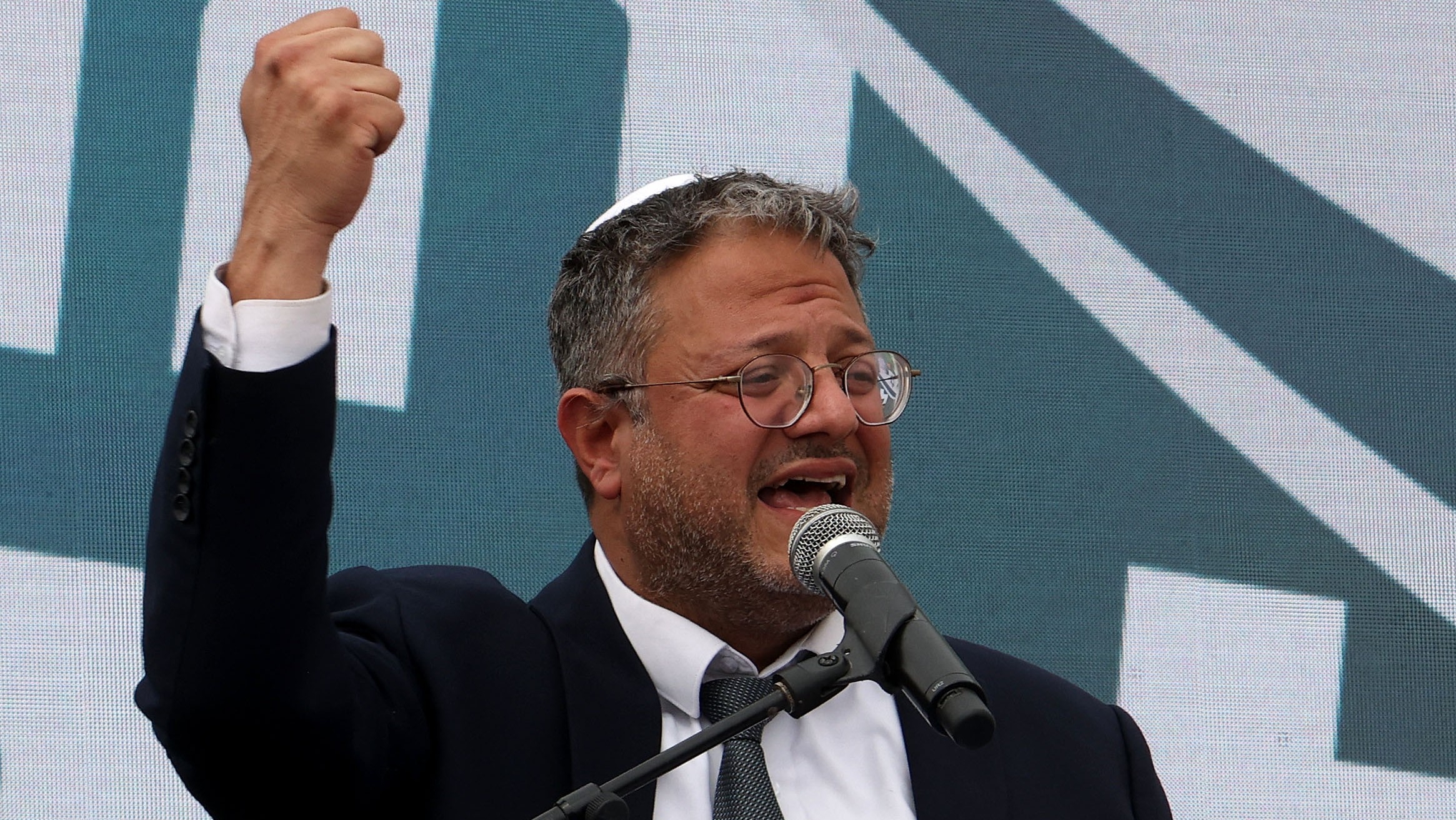 Israel's far-right National Security Minister Itamar Ben-Gvir delivers a speech during a rally in the illegal outpost of Eviatar, near the Palestinian village of Beita in the occupied West Bank, on 10 April 2023 (AFP/Gil Cohen Magen)