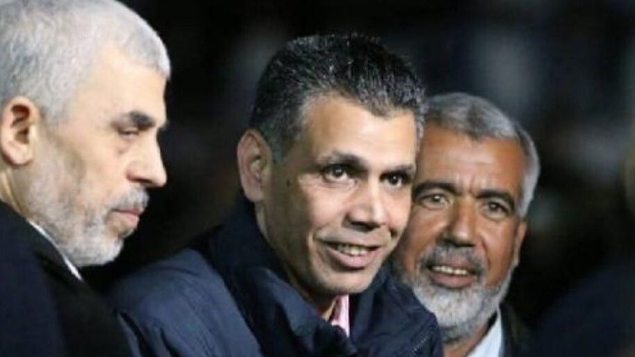 Major General Ahmed Abdel Khalek, in centre, with Hamas leaders in Gaza in 2018 (X/@JihadAlSharif)