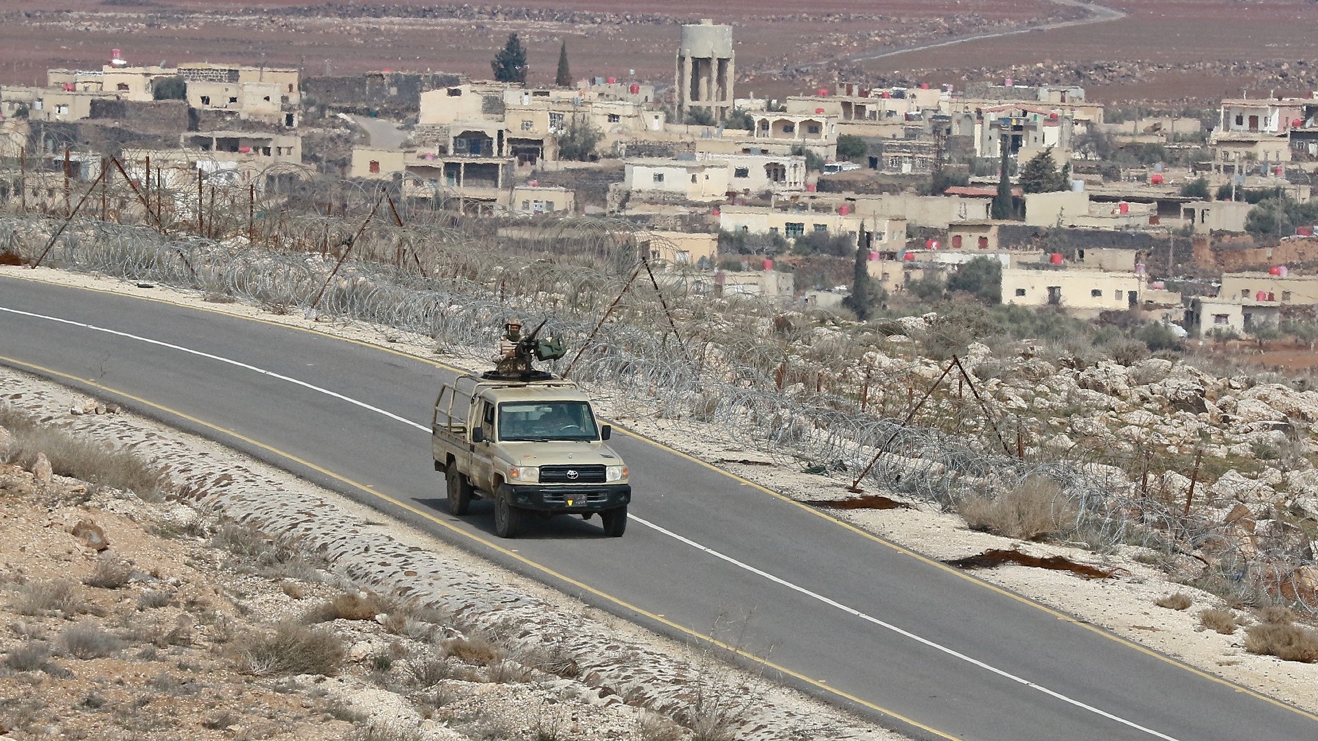 A picture taken during a tour organised by the Jordanian Army shows soldiers patrolling along the border with Syria to prevent drug trafficking on 17 February 2022 (AFP)