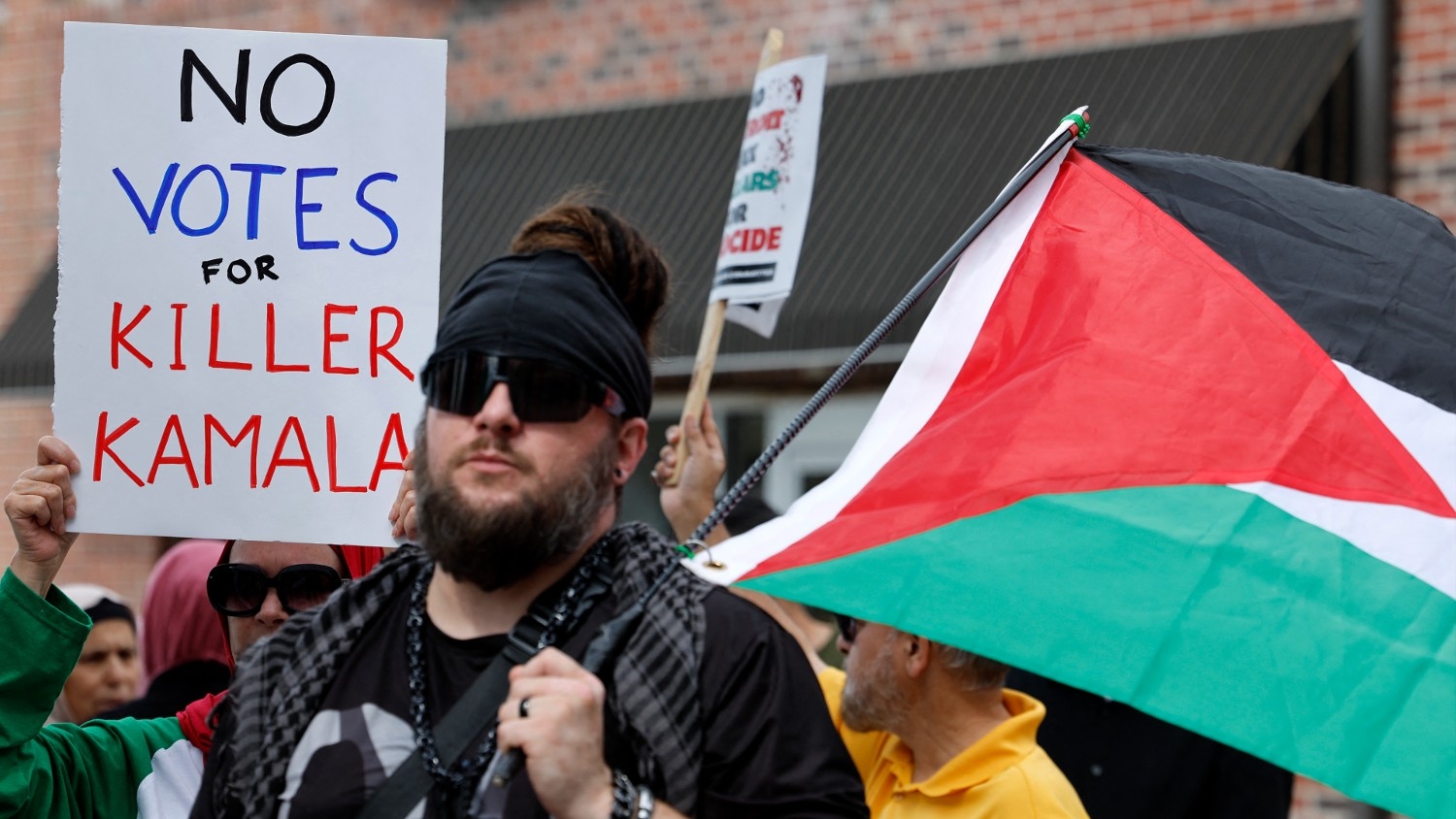 Pro-Palestinian demonstrators protest in support of the Palestinians who have died in Gaza outside of the Arab American National Museum in Dearborn, Michigan, on 11 August 2024.