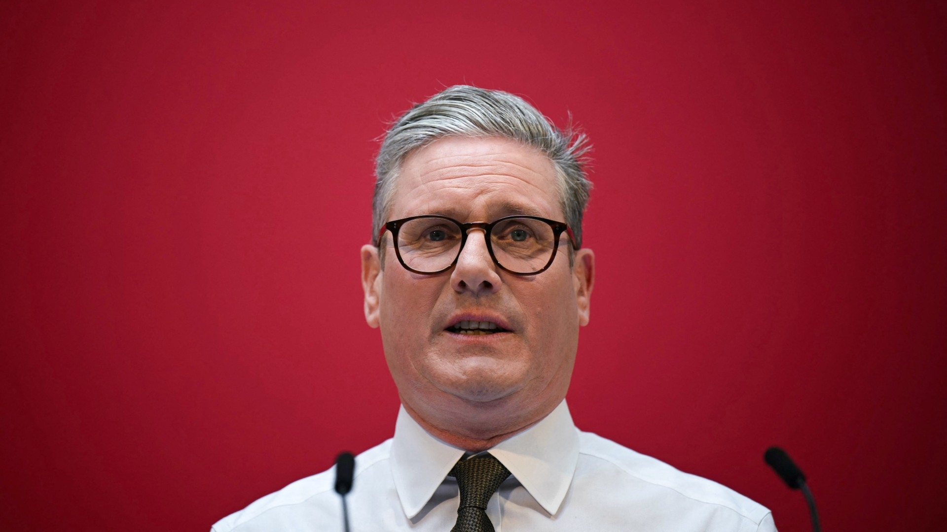 Keir Starmer, the leader of Britain's main opposition Labour Party, delivers a speech in Manchester on 13 June 2024 (AFP/Oli Scarff)