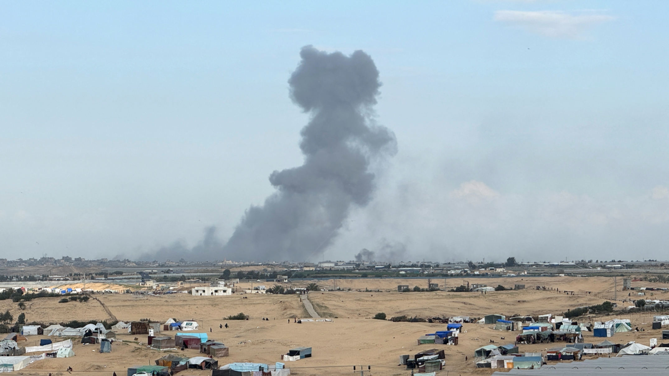 Smoke rises following an Israeli strike on Khan Younis on 14 February, 2024 (Reuters/Bassam Masoud).