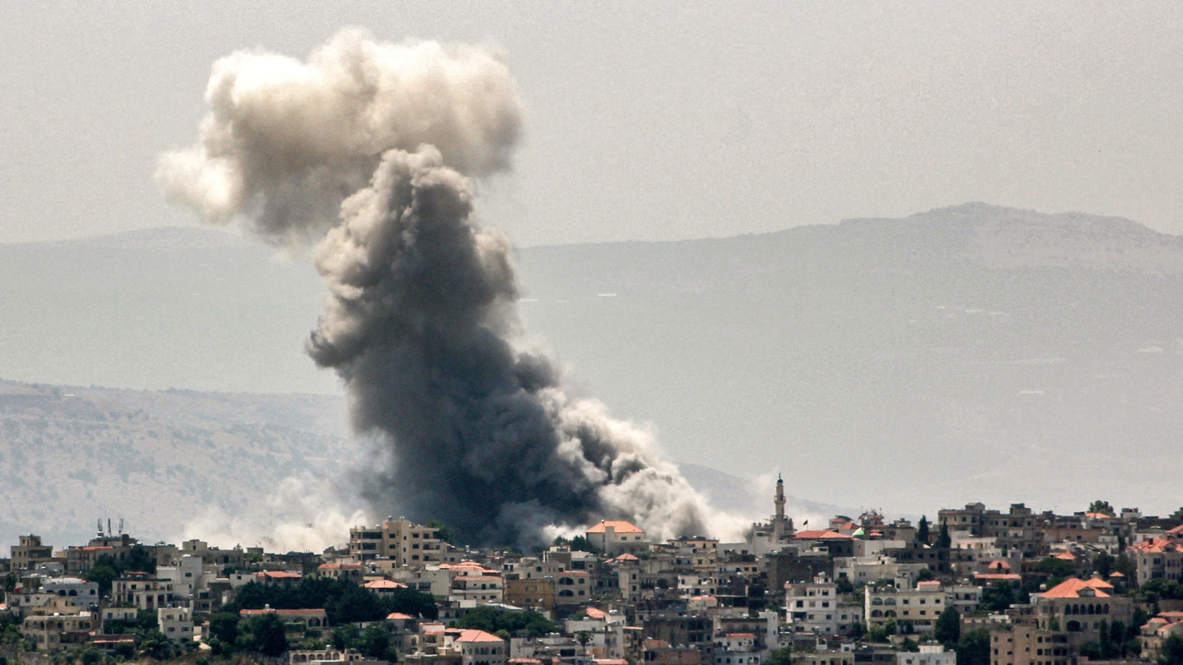 Smoke rises following an Israeli strike on the town of Khiam in southern Lebanon on 19 June 2024 (Rabih Daher/AFP)