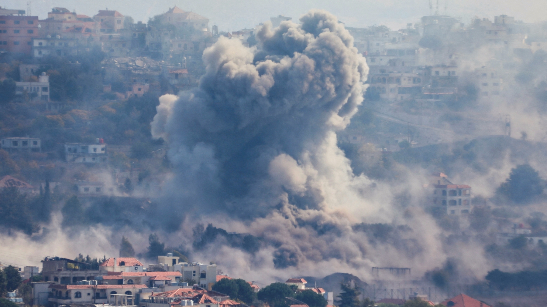 Smoke billows over Khiam, southern Lebanon following an Israeli air strike on the town on 30 October 2024 (Karamallah Daher/Reuters)