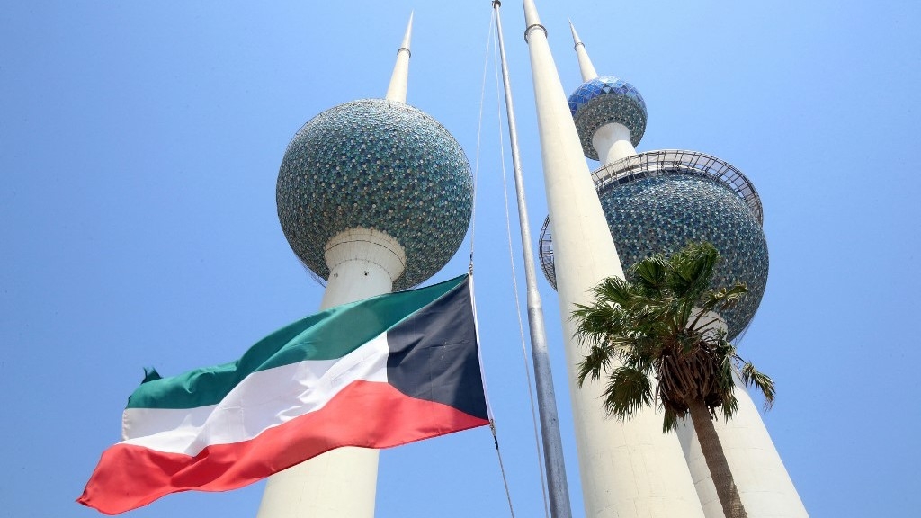 The Kuwaiti national flag flies at half-mast in Kuwait City on September 9, 2022 (AFP)