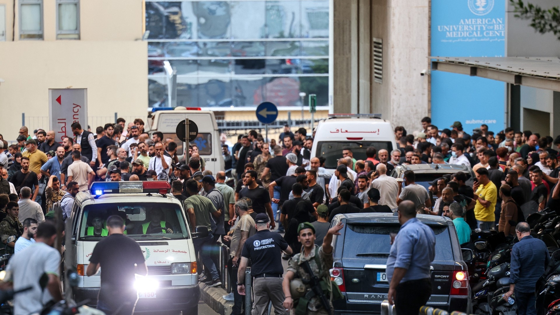 Ambulances are surrounded by people at the entrance of the American University of Beirut Medical Center, on 17 September, 2024 after pagers usually used by Hezbollah members exploded across Lebanon (Anwar Amro/AFP)