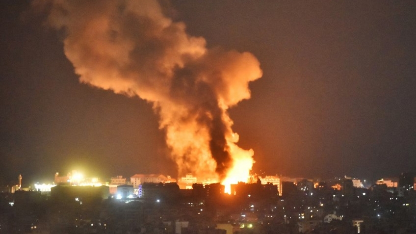 Fire and smoke rise from an area targeted by an Israeli air strike in Beirut’s southern suburbs on 6 October 2024 (Fadel Itani/AFP)