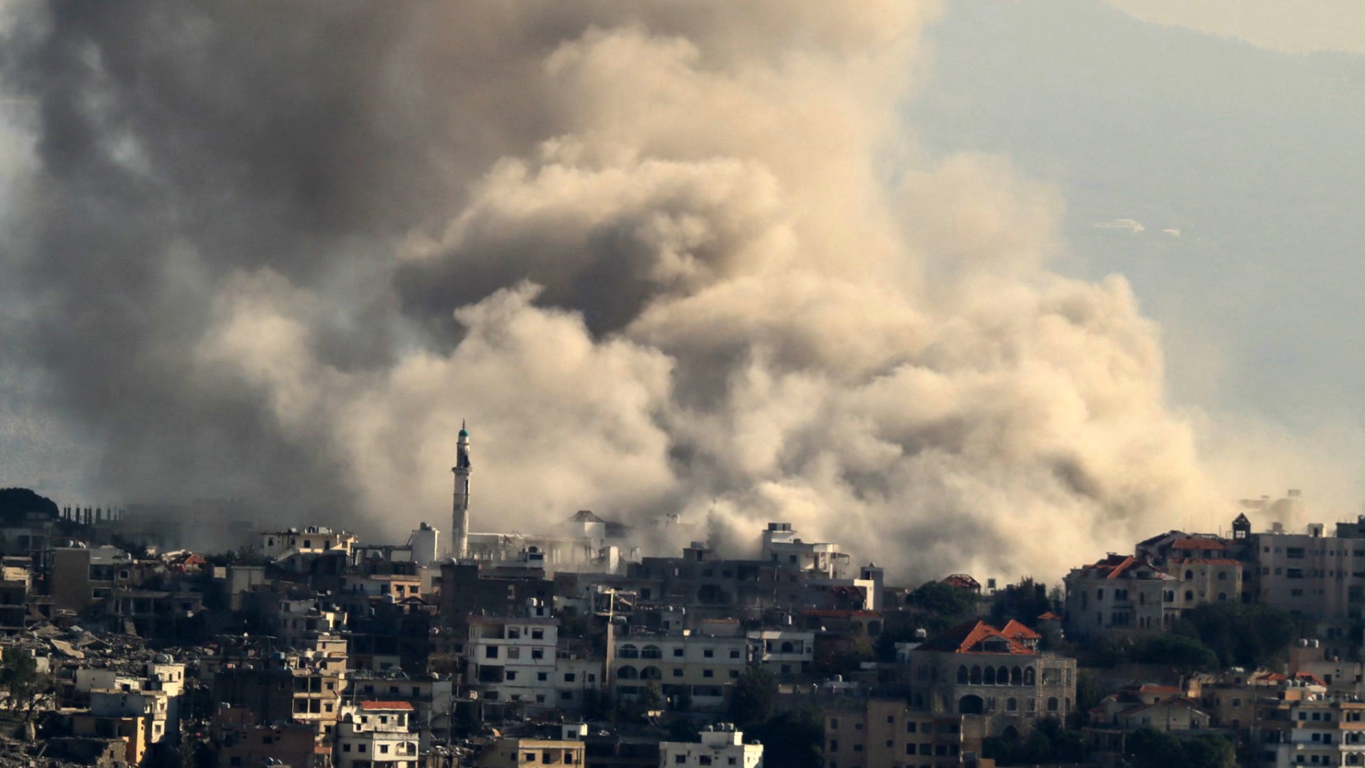 Smoke rises rises Israeli forces reportedly demolish dwellings in the border town of Khiam, southern Lebanon on 1 December 2024 (AFP)