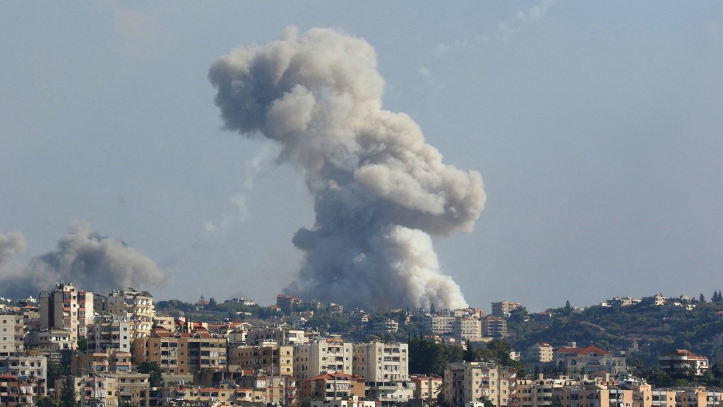 Smoke billows from a site targeted by Israeli shelling in the southern Lebanese village of Zeita on 23 September 2024 (Mahmoud Zayyat/AFP)