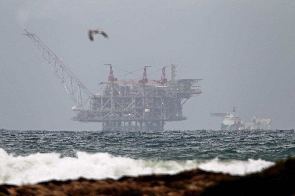 The platform of the Leviathan natural gas field in the Mediterranean Sea is pictured from the northern Israeli coastal city of Dor on 31 December 2019