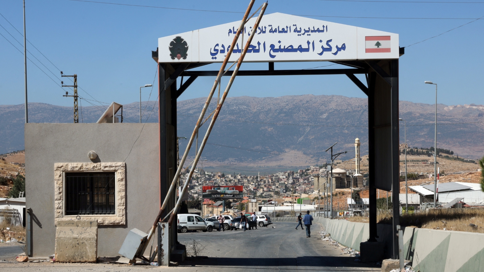 People walk at Masnaa border crossing between Lebanon and Syria, in Bekaa Governorate, Lebanon, on 4 October 2024 (Mohamed Azakir/Reuters)