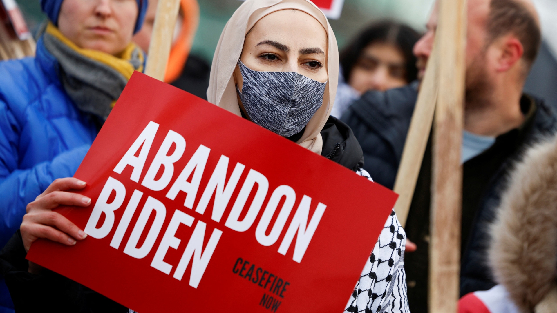 Protesters rally for a ceasefire in Gaza outside a United Auto Workers union hall during a visit by US President Joe Biden in Warren, Michigan, on 1 February 2024 (Rebecca/Reuters)