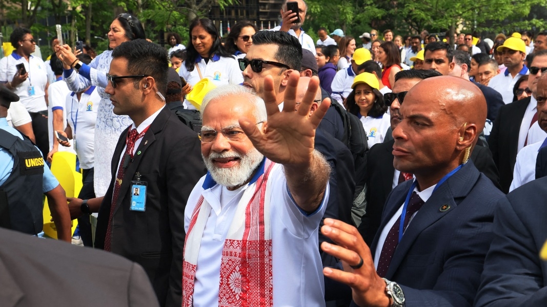 Indian Prime Minister Narendra Modi waves to supporters after performing yoga at the United Nations headquarters on 21 June 2023 in New York City.