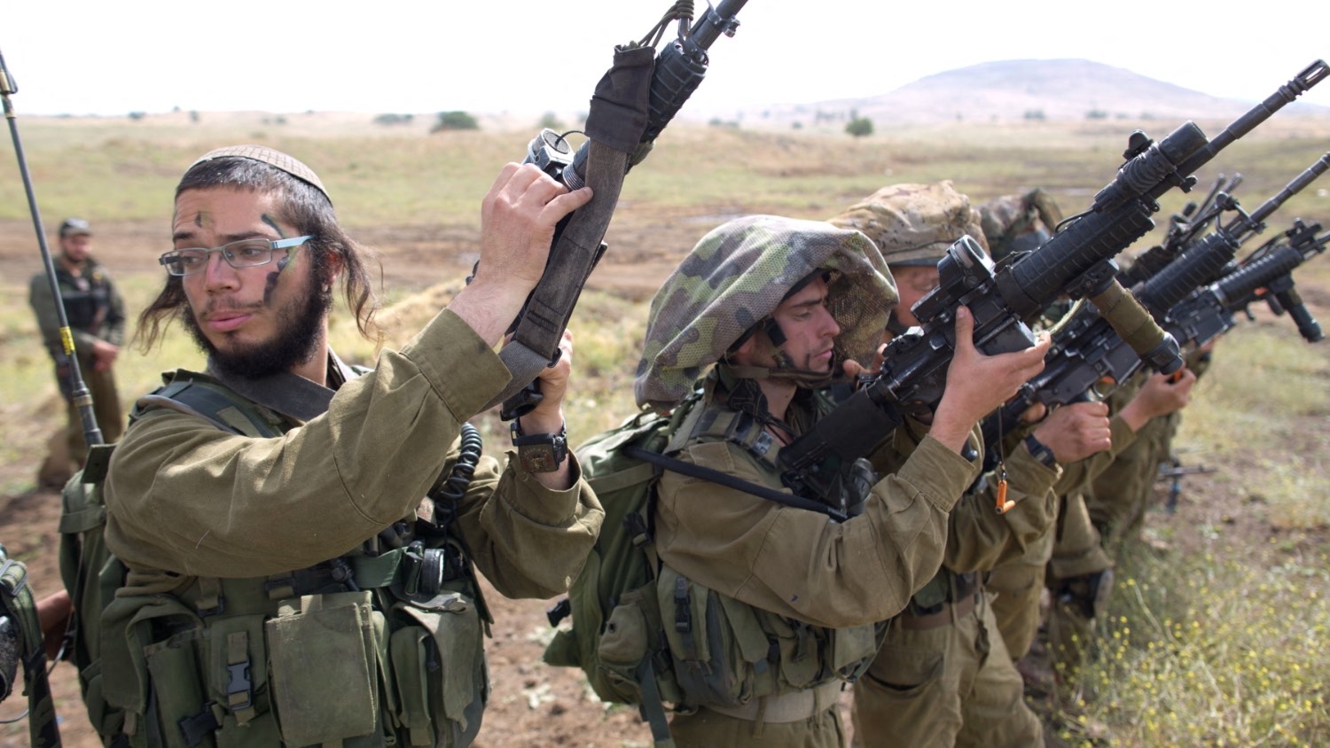 Israeli soldiers of the Ultra-Orthodox battalion "Netzah Yehuda" take part in their annual unit training in the Israeli-occupied Golan Heights on 19 May 2014.