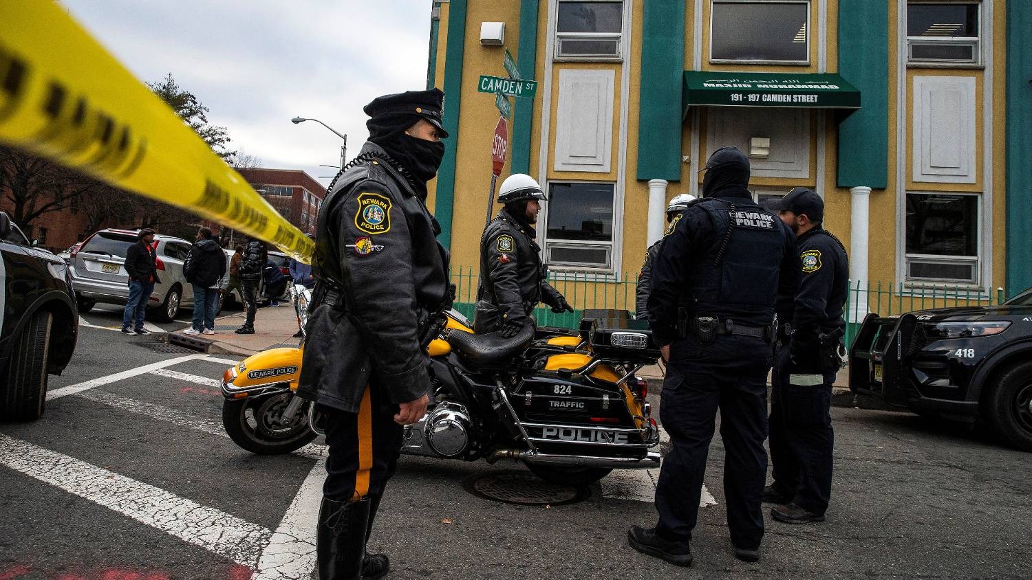 Newark Police Officers stand guard outside the Masjid Muhammad mosque after the shooting of Imam Hassan Sharif in Newark, New Jersey, 3 January 2024.